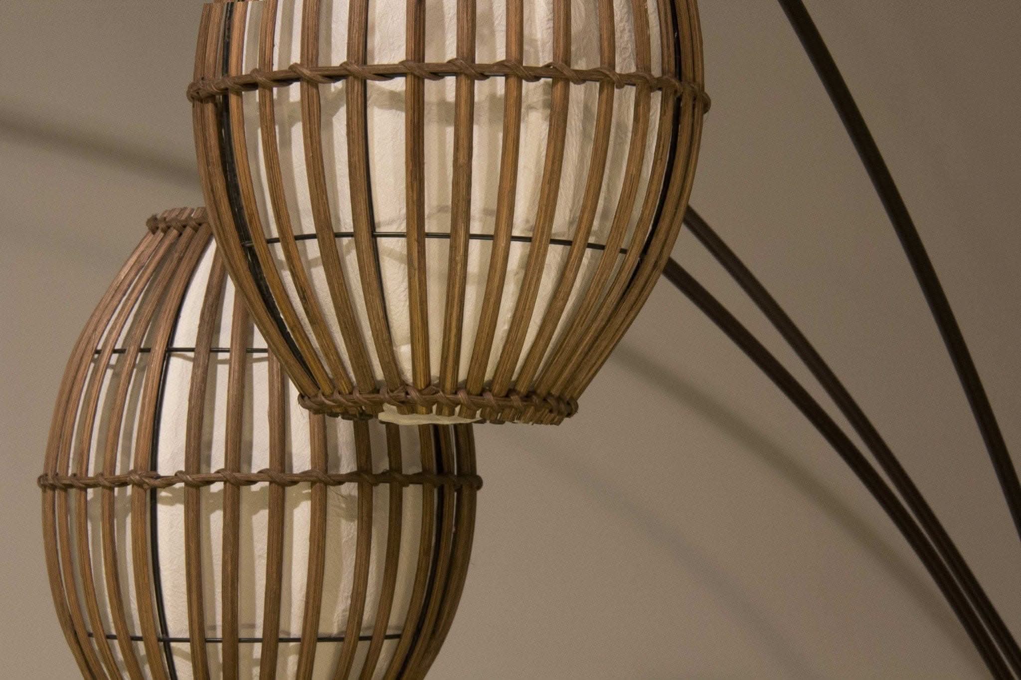 Bronze Three Light Arc Lamp with brown cane barrel lanterns.